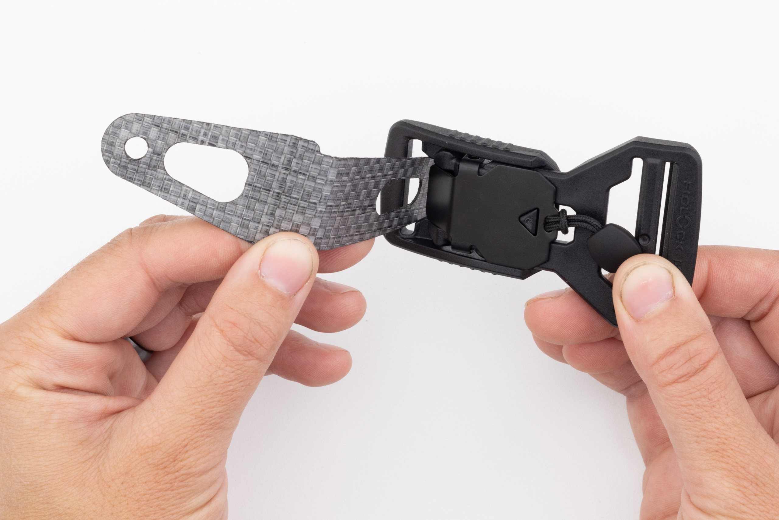 Photo of Enigma buckle tab and buckle.