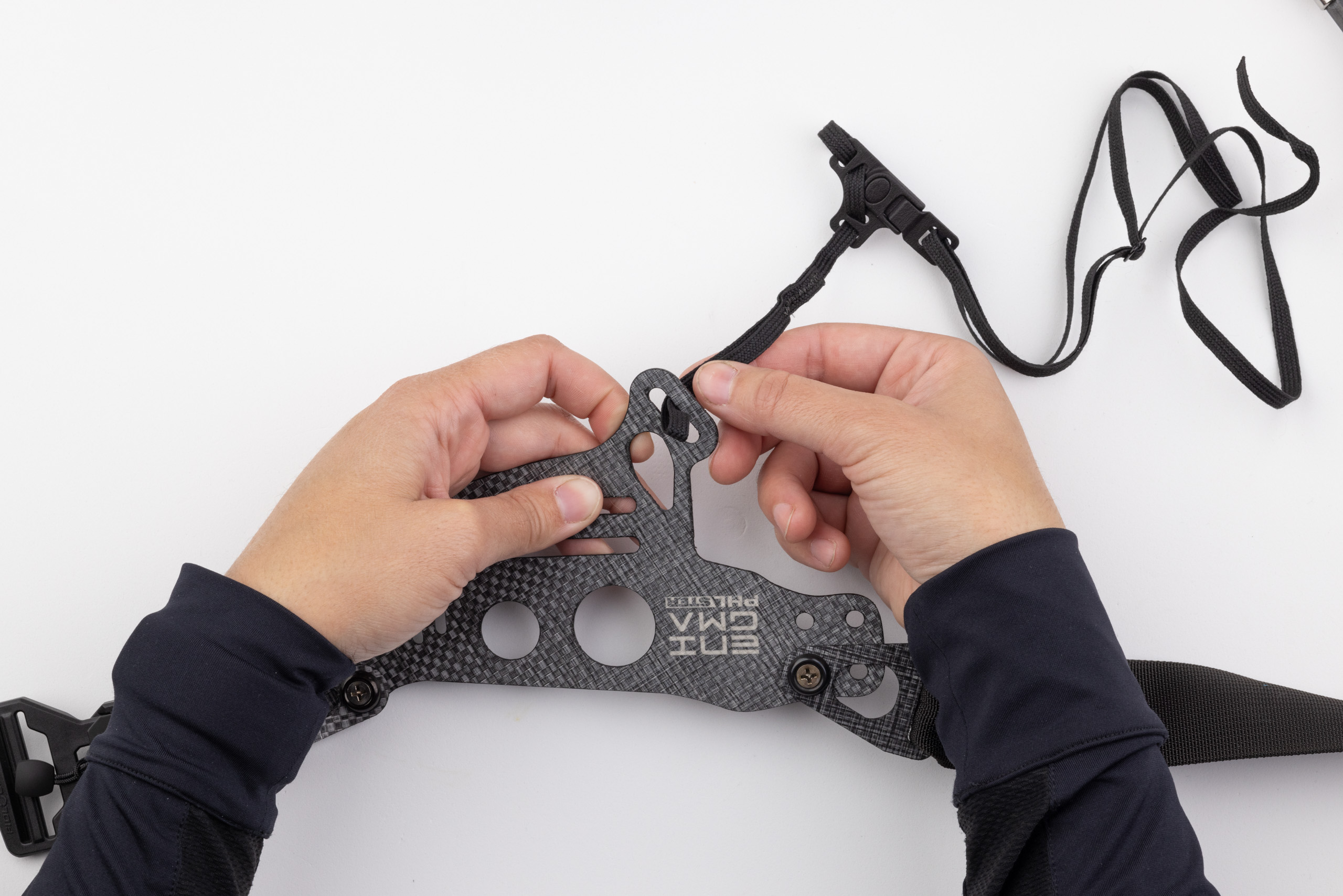 Photo of leg leash being routed through Enigma faceplate.