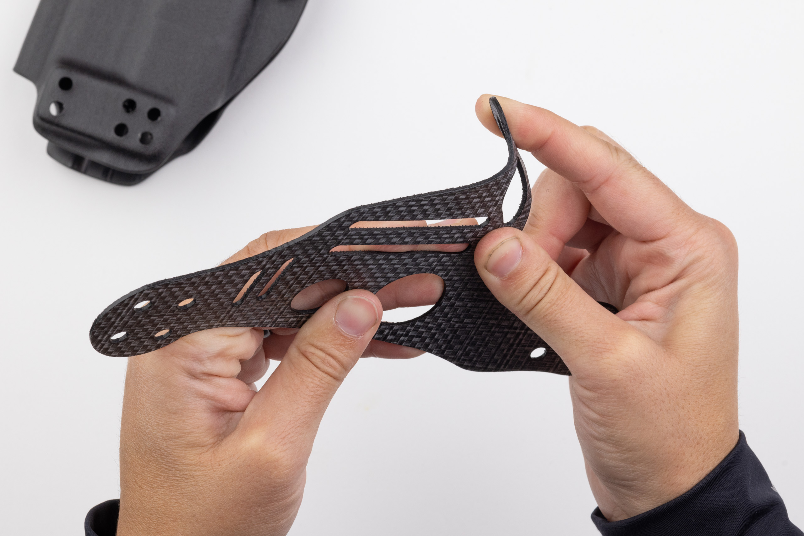 Photo of folding over the leg leash tab on Gen 1 Light bearing Enigma.