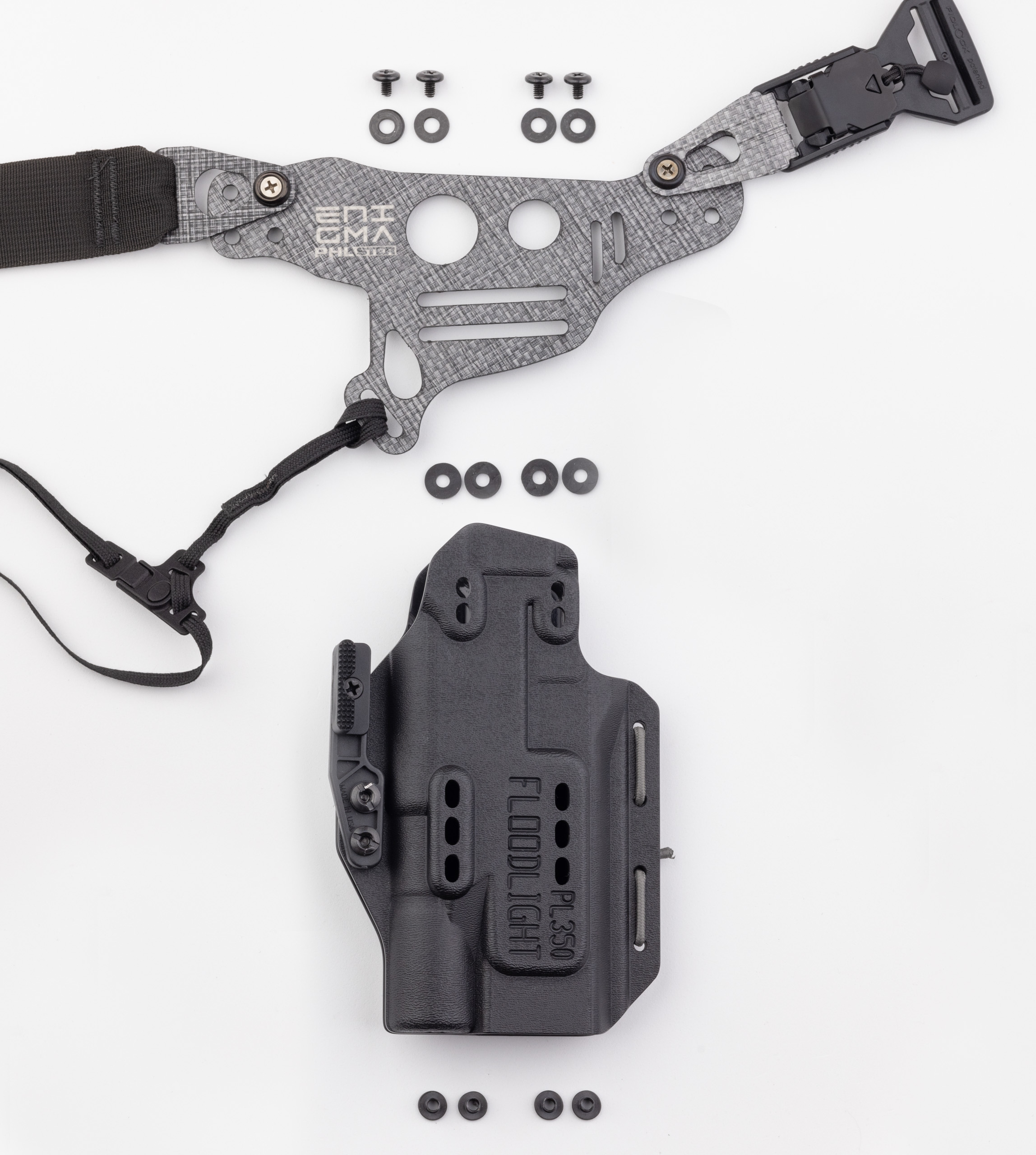 Photo of Light Bearing Enigma faceplate, holster, and holster hardware.