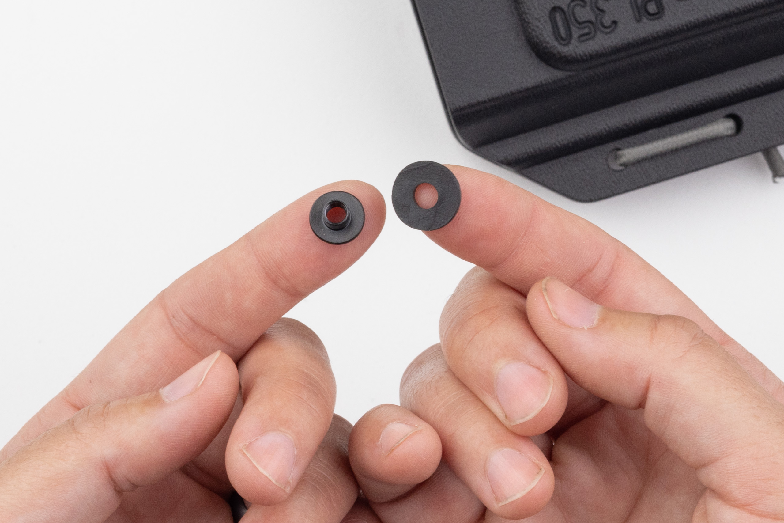 Photo of screw post and rubber washer.