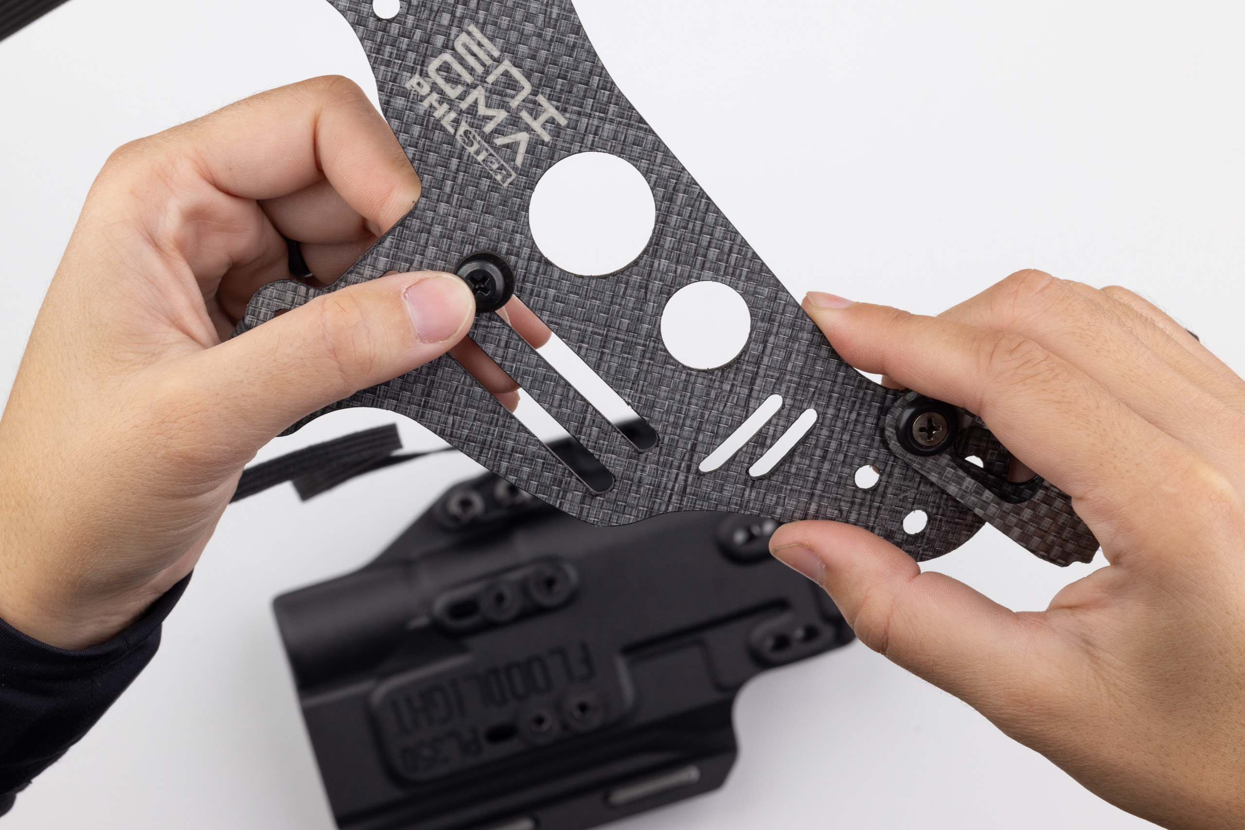 Photo of screw and washer on Light Bearing Enigma faceplate.