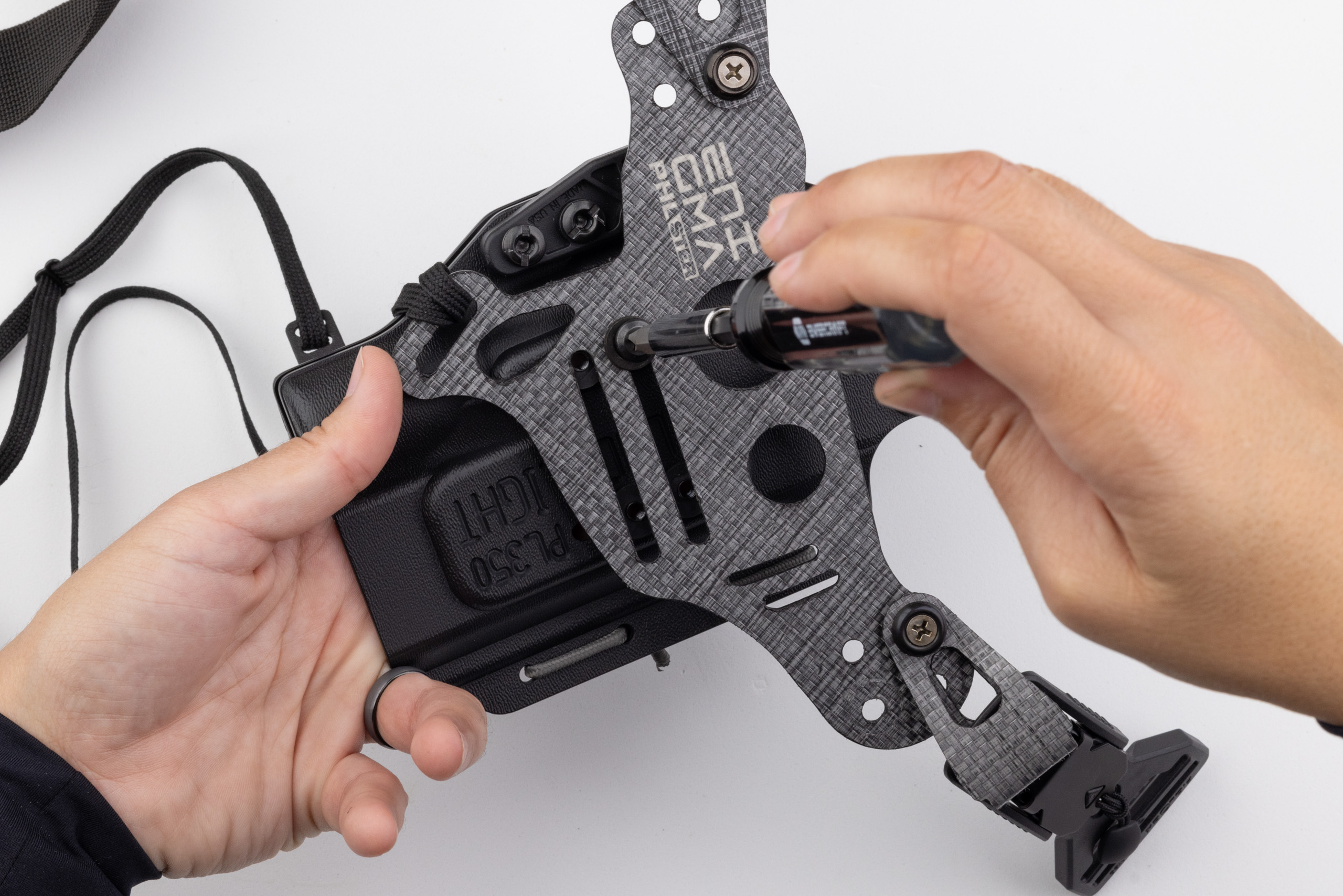 Photo of screwdriver tightening screw on Light Bearing Enigma.