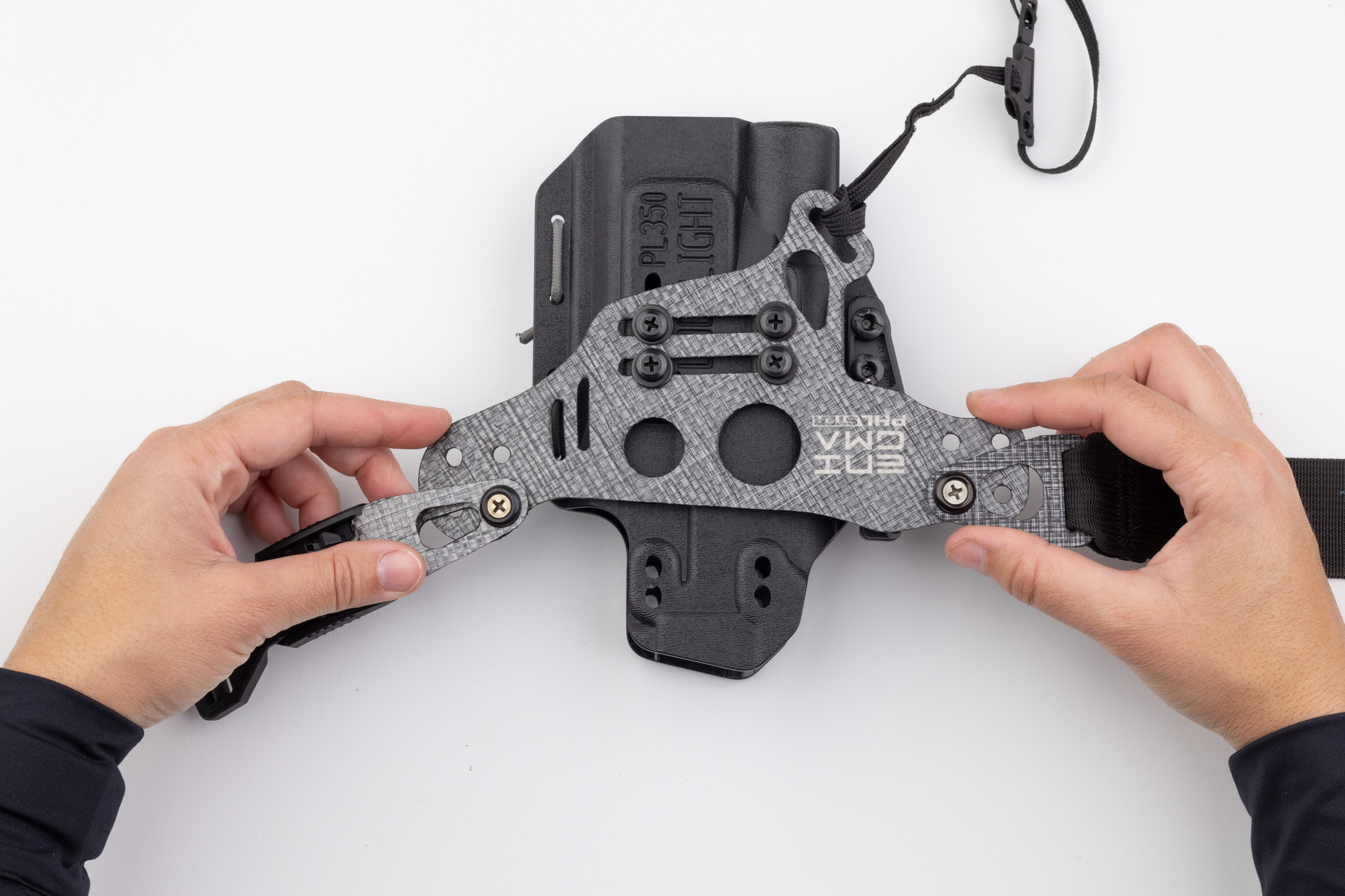 Photo showing how to check Enigma faceplate and holster for straightness.