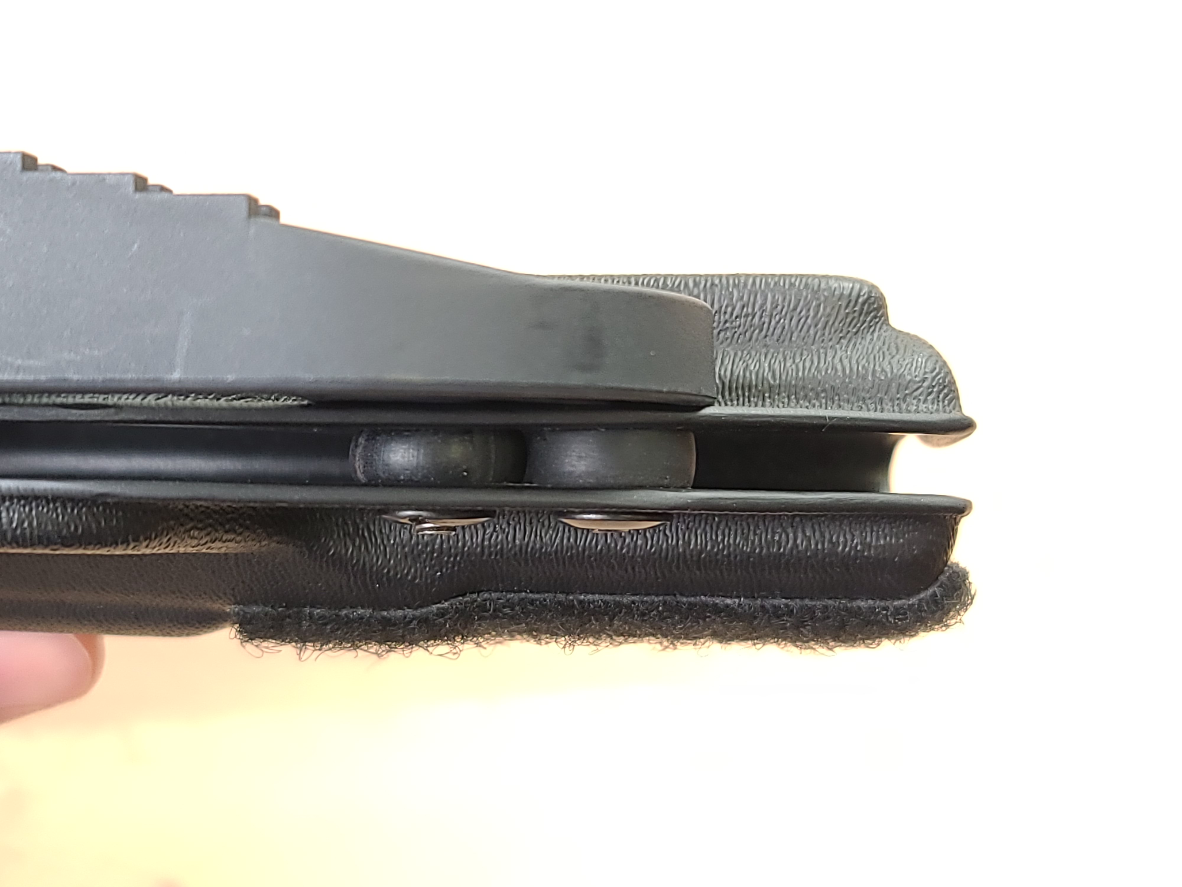 Rubber retention washers on an adjustable retention kydex holster.