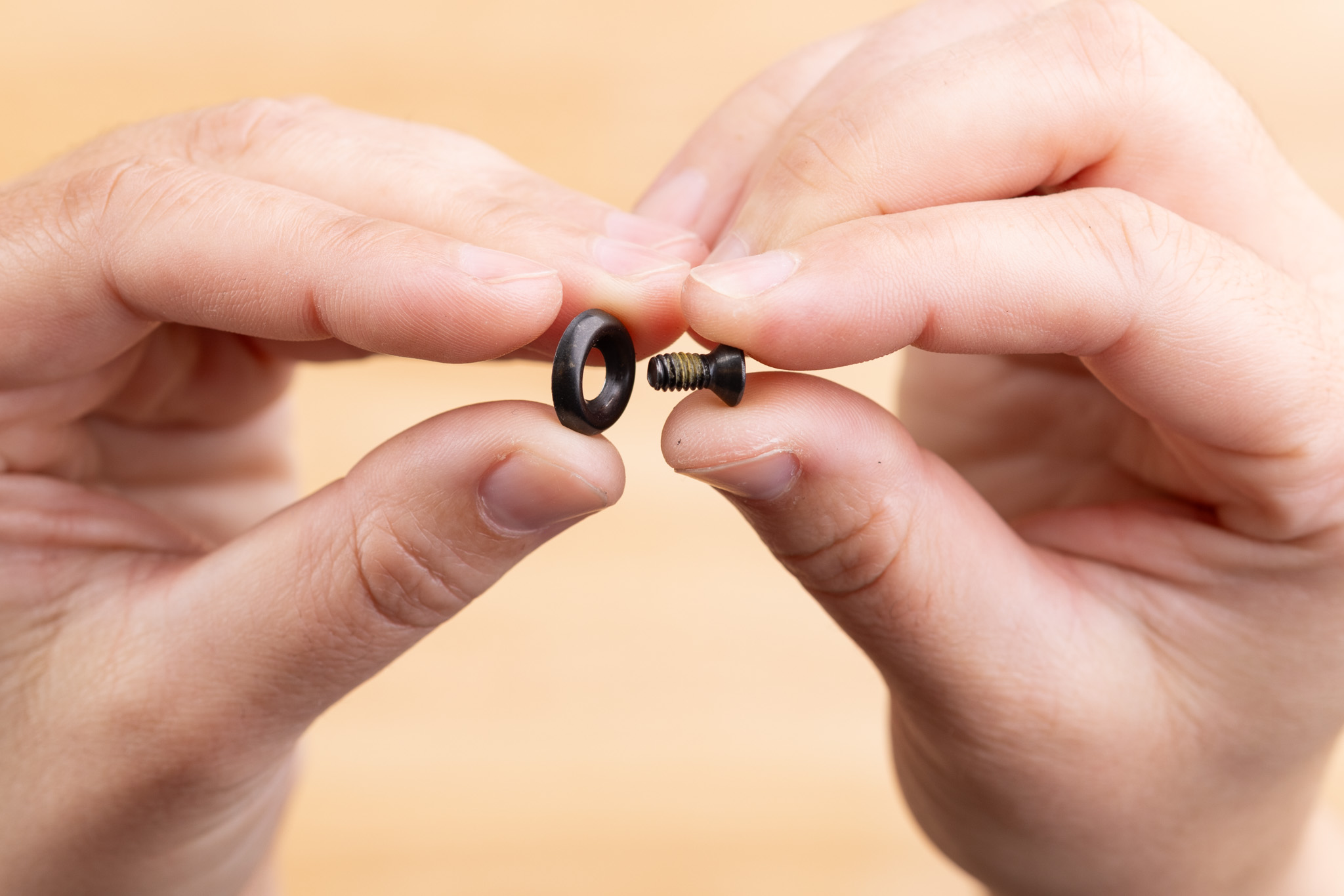 Photo of screw going through finish washer.