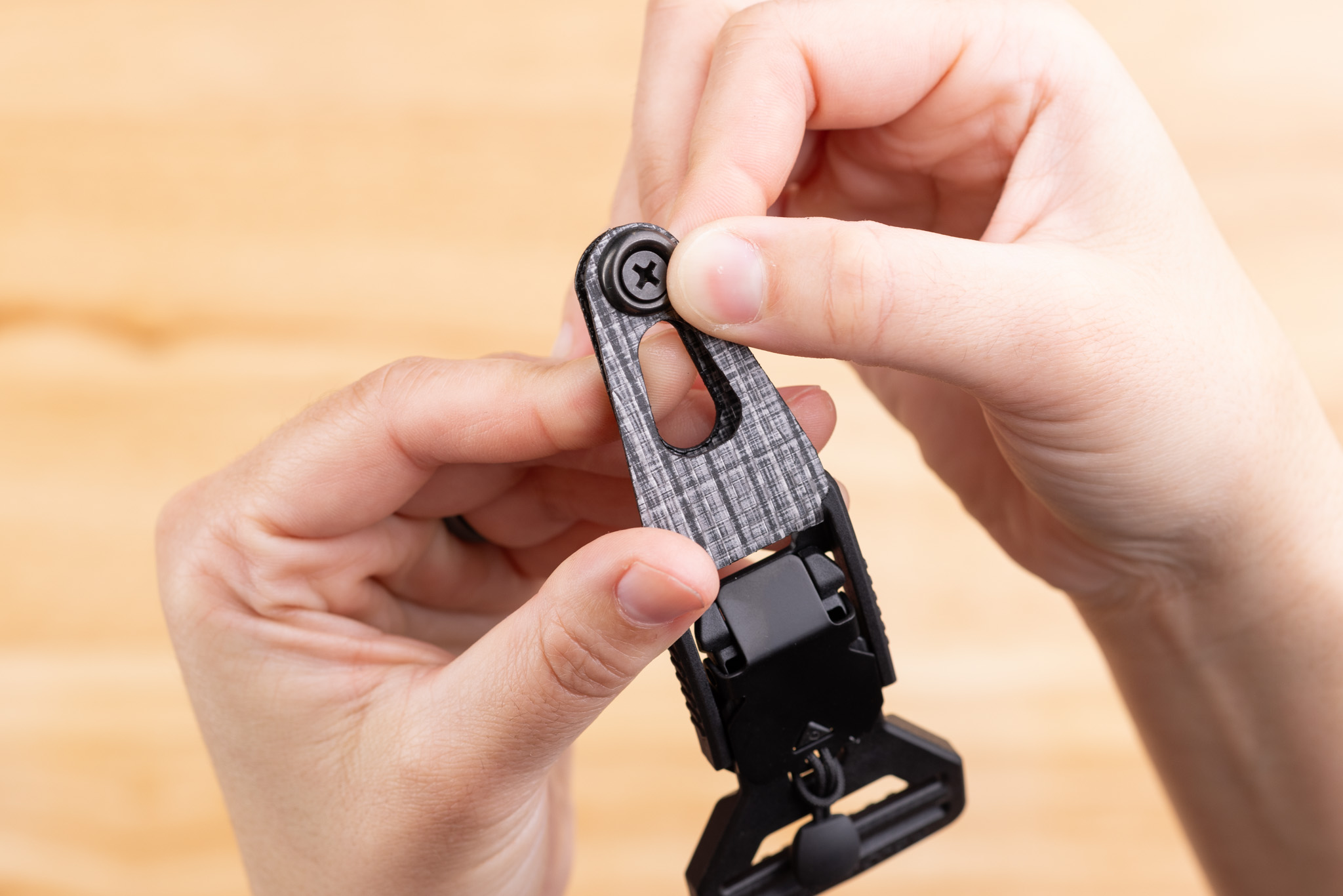 Photo of screw going through Enigma belt end.