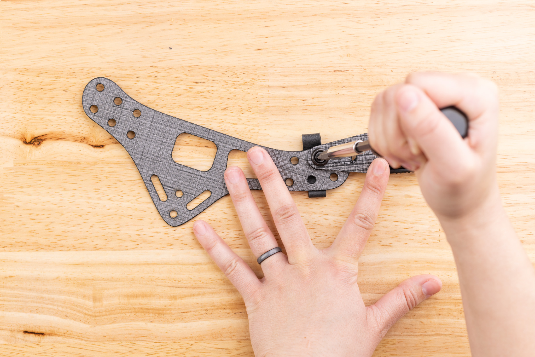 Photo showing tightening Enigma screws.