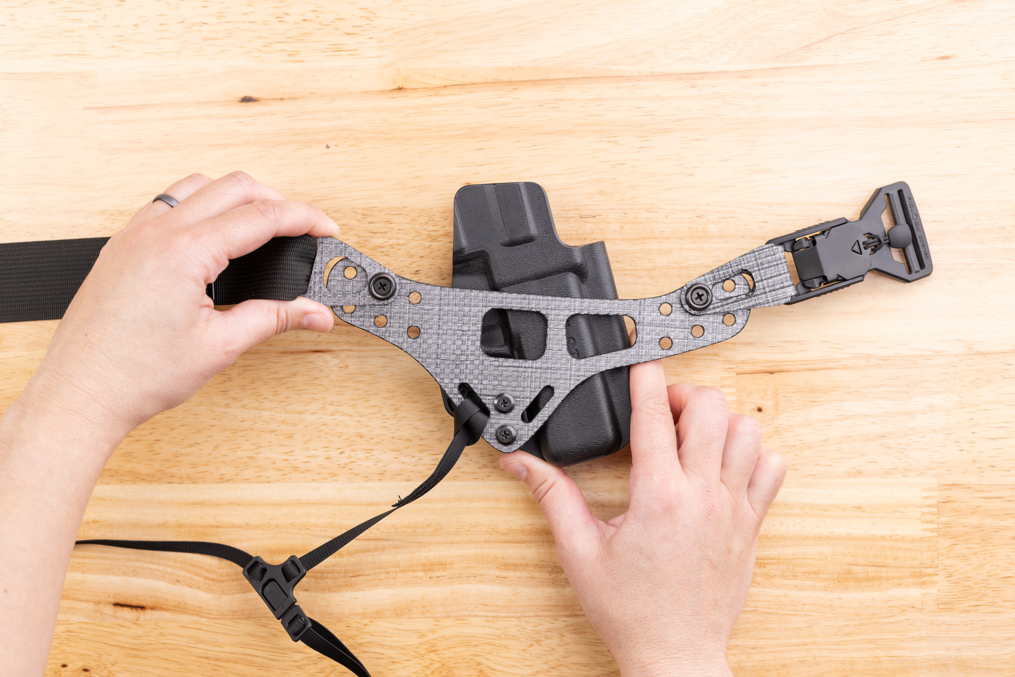 Photo of Enigma faceplate installed crooked on holster.