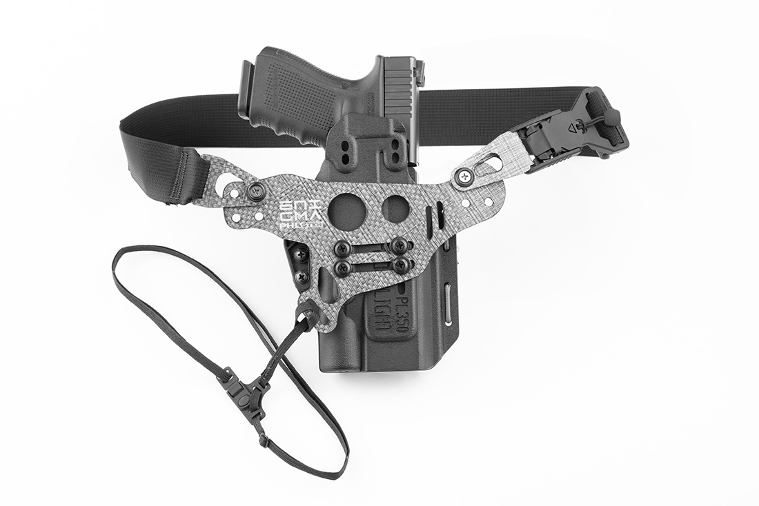 Photo of fully assembled Light Bearing Enigma, holster, and Glock 19 pistol.